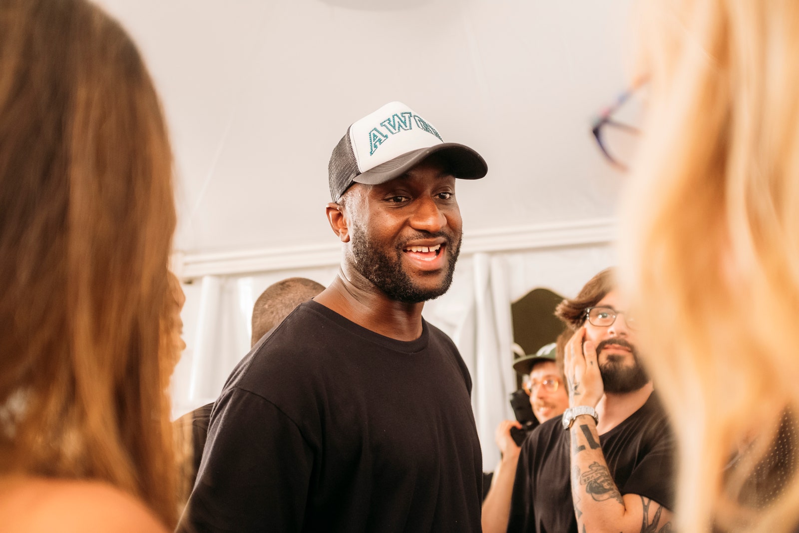 Image may contain Skin Human Person Hat Clothing Apparel Virgil Abloh Tattoo and Face