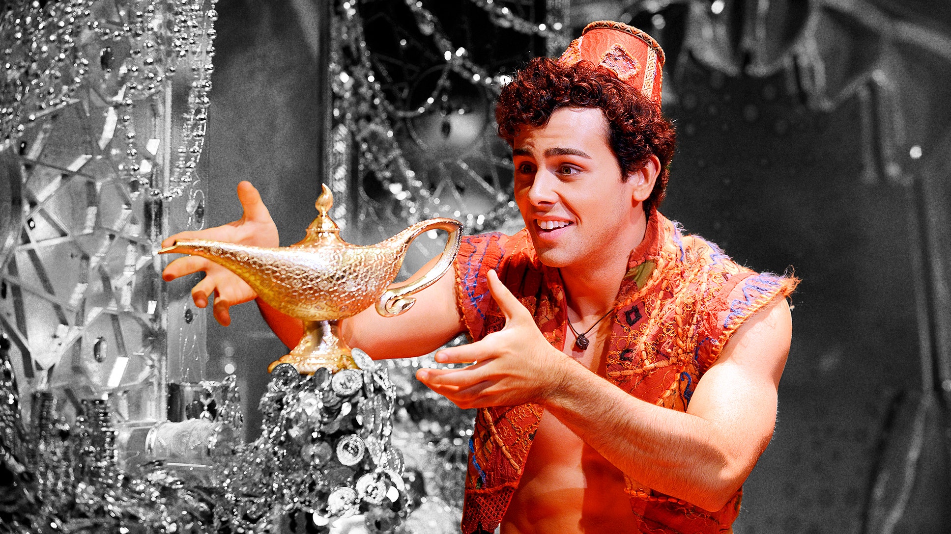 ainsly melham in aladdin costume grabbing magic lamp