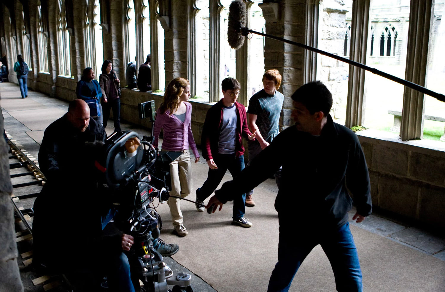 Emma, Dan and Rupert filming in a corridor