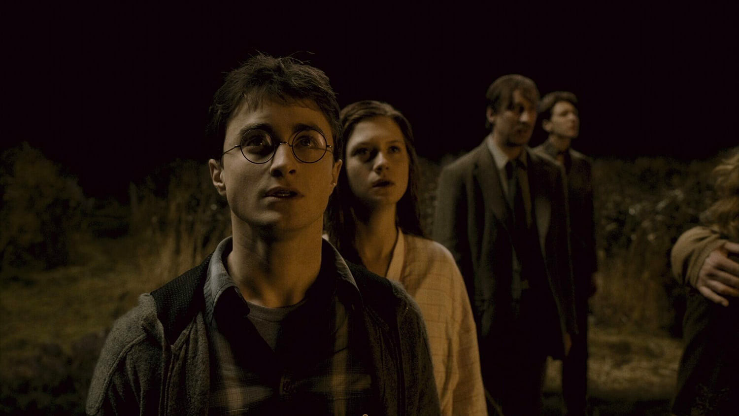 Harry and Ginny watch The Burrow burn