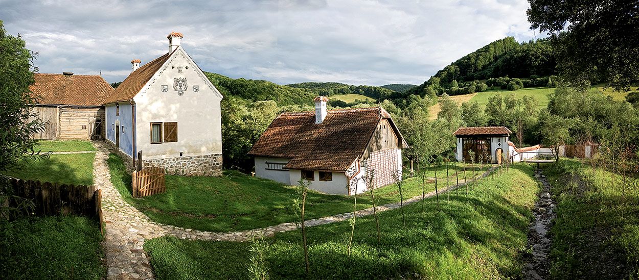 Image may contain Nature Outdoors Building Housing Countryside Cottage House Hut Rural Shack Human and Person