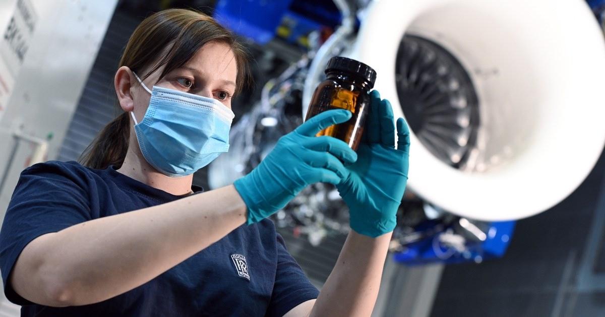 Rolls-Royce employee working with face mask