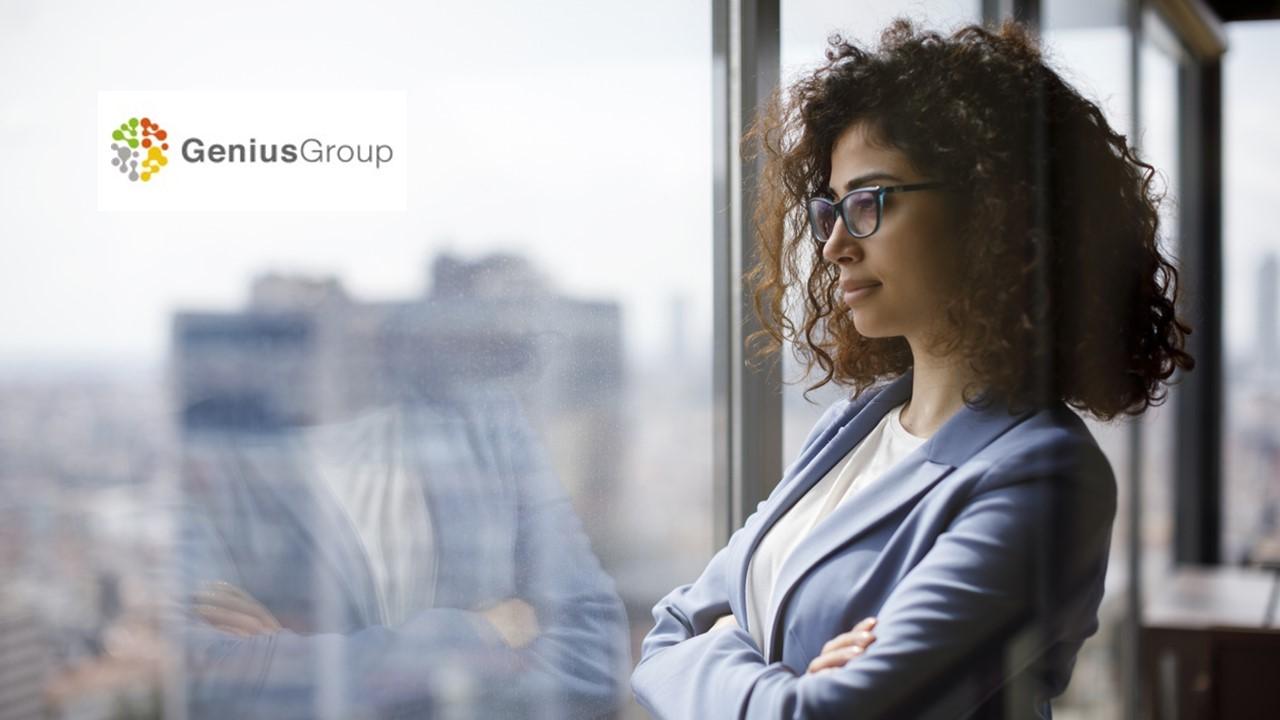 Woman looking out a window and Genius Group logo