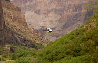 Helicopter approaches Whitmore Wash in Grand Canyon with OARS guests