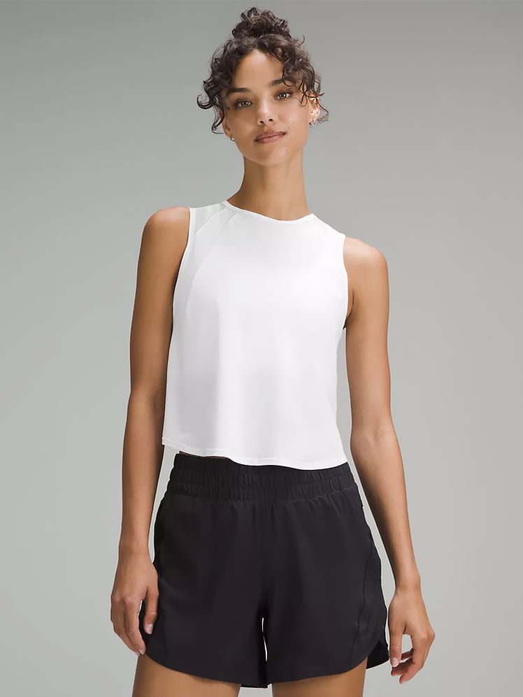 Sculpt Cropped Tank Top in white on model on dark gray background