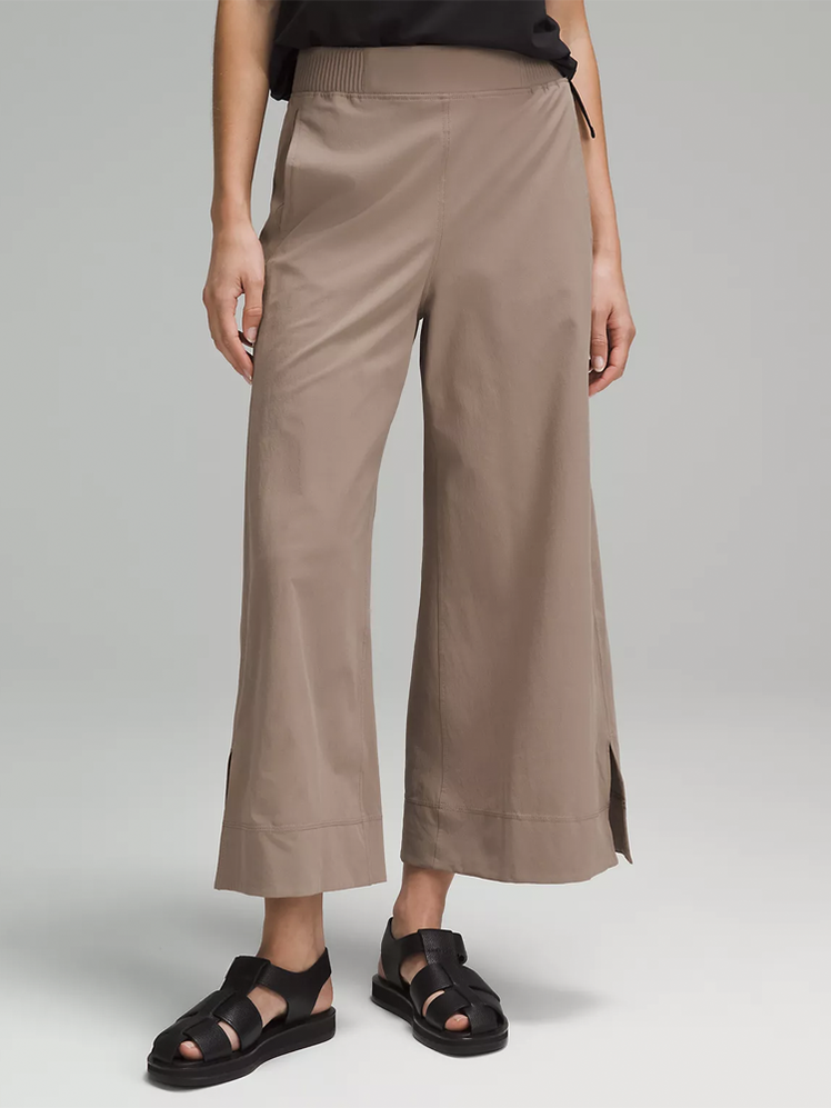 Stretch Woven High-Rise Wide-Leg Cropped Pant in muted brown on model on gray background