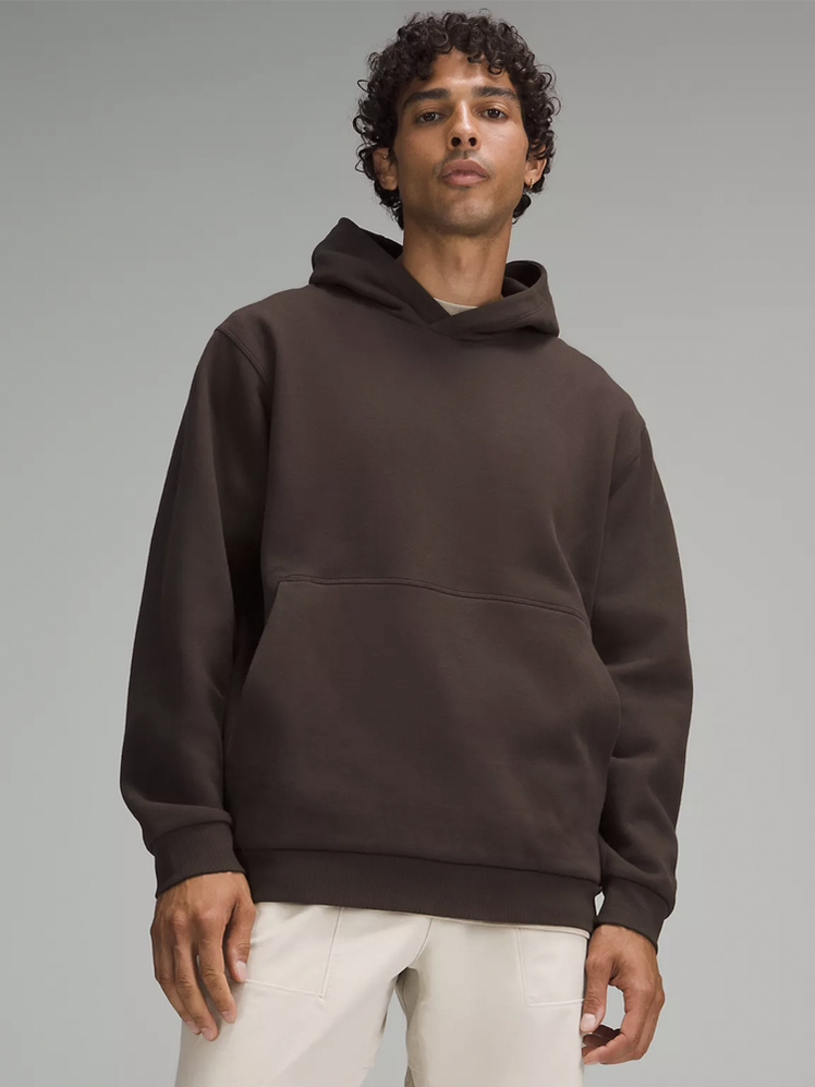 Steady State Pullover Hoodie in dark brown on model on dark gray background