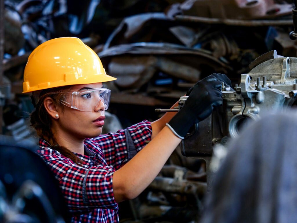 Female worker working on manufacturing efficiency tasks