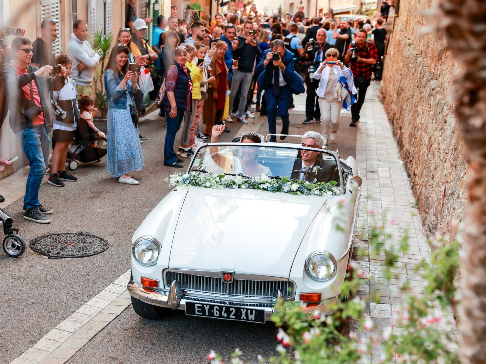 The newlyweds leave the religious ceremony