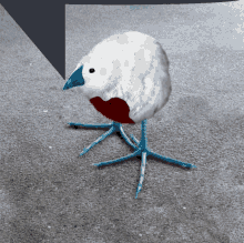 a white bird with blue feet and a red heart on its chest