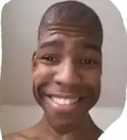 a man with a shaved head is smiling with his mouth open