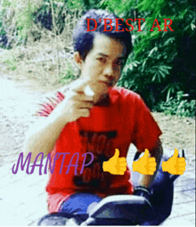 a man in a red shirt is giving a thumbs up with the words mantap below him