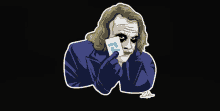 a joker holding a card that has the letter f on it