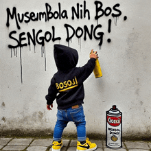 a little boy spray paints graffiti on a wall that reads musumbola nih bos sengol dong