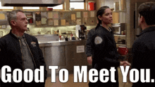 a group of people are standing in a kitchen with the words " good to meet you " above them