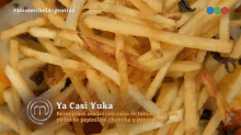 a close up of french fries with the name ya casi yuka on the bottom