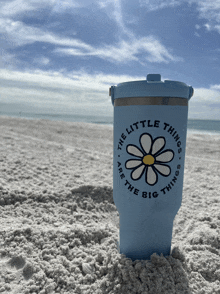 a cup that says " the little things are the big things " on it