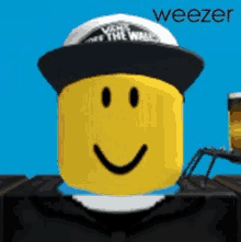 a smiley face wearing a hat with the word weezer on the bottom