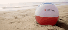 a red white and blue beach ball that says i heart fort pierce