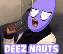 a person with a purple mask on their face is talking on a cell phone with the words deez nauts written below them