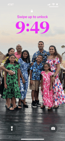 an at & t phone screen shows a family posing for a photo