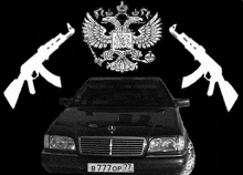 a black and white photo of a mercedes with two ak47 guns and a russian coat of arms on it .