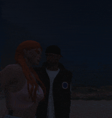 a man and woman are standing next to each other in the dark