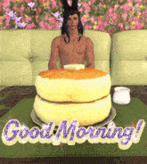 a man sits on a couch next to a stack of pancakes with the words good morning written on it