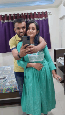 a man is taking a selfie with his wife