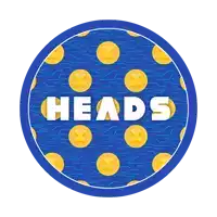 a blue circle with gold coins and the word heads on it