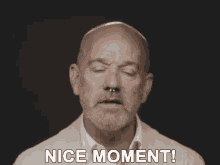 a man with a beard and nose ring says " nice moment "