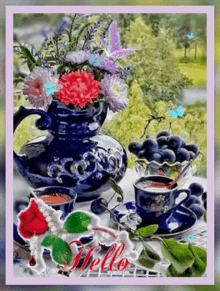 a bouquet of flowers in a blue vase sits on a table next to two cups of tea