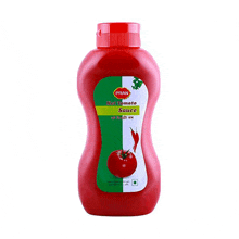 a bottle of pran hot tomato sauce with a picture of a tomato on it