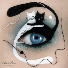 a close up of a woman 's eye with a black and white cat on it