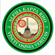 a green and red logo for alpha kappa rho with a statue in the center