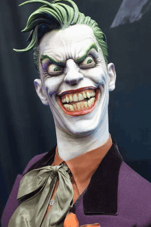 a statue of the joker with a big smile