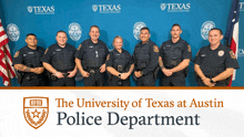 a group of police officers are posing for a photo in front of the university of texas at austin police department logo