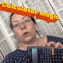 a woman wearing glasses is holding a calculator in her hand