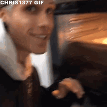 a chris1377 gif of a man looking into a microwave