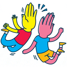 two people are giving each other a high five while jumping in the air .