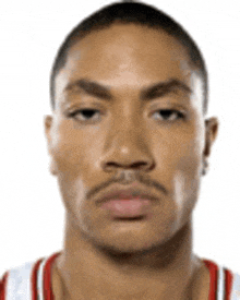 a close up of a man 's face with a red and white striped shirt .