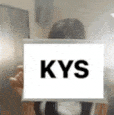 a woman is holding a sign that says kys .