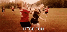 a group of women are playing lacrosse on a field and one of them is holding a lacrosse stick .