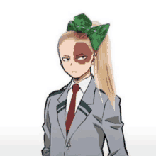 a woman in a suit and tie with a green bow in her hair .