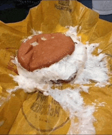 a mcdonald 's hamburger with a lot of foam on it