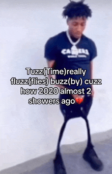 a blurred image of a person with a caption that says tuzz