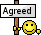 a smiley face is holding a sign that says agreed .