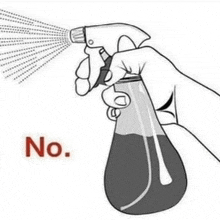 a hand is holding a spray bottle with the words `` no '' written on the bottom .