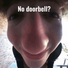 a close up of a person 's face with the words " no doorbell " on it