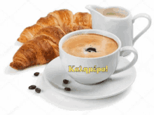 a cup of coffee next to a pitcher of milk and croissants with the word kalimera on it